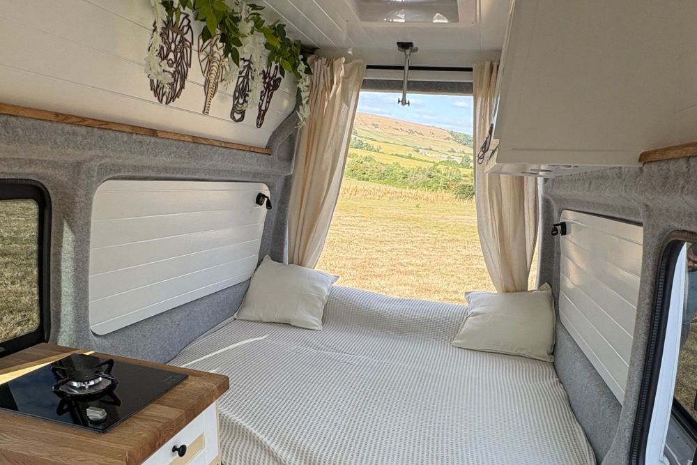 VW Campervan Competition - interior bed with view